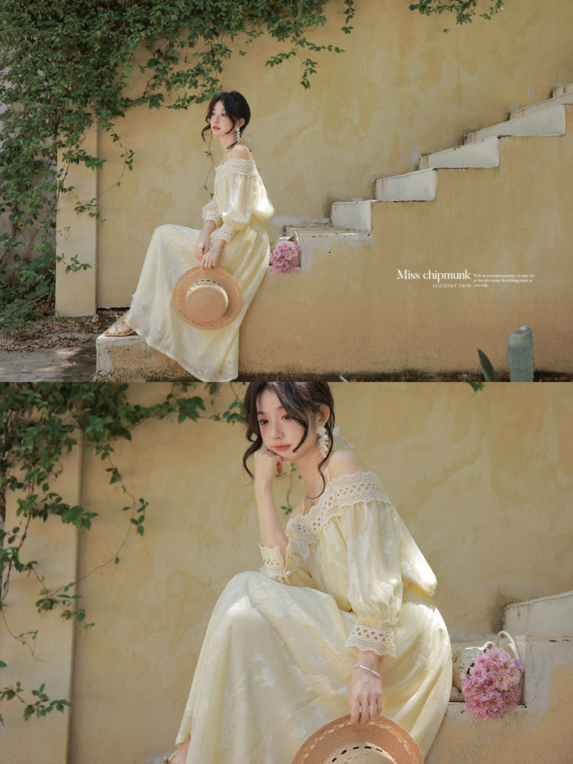 Woman wearing a light cream off-shoulder long dress outdoors
