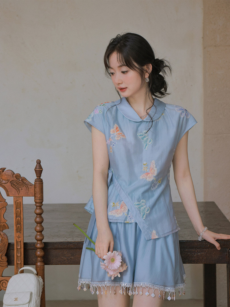 Light blue embroidered two-piece outfit worn by a model