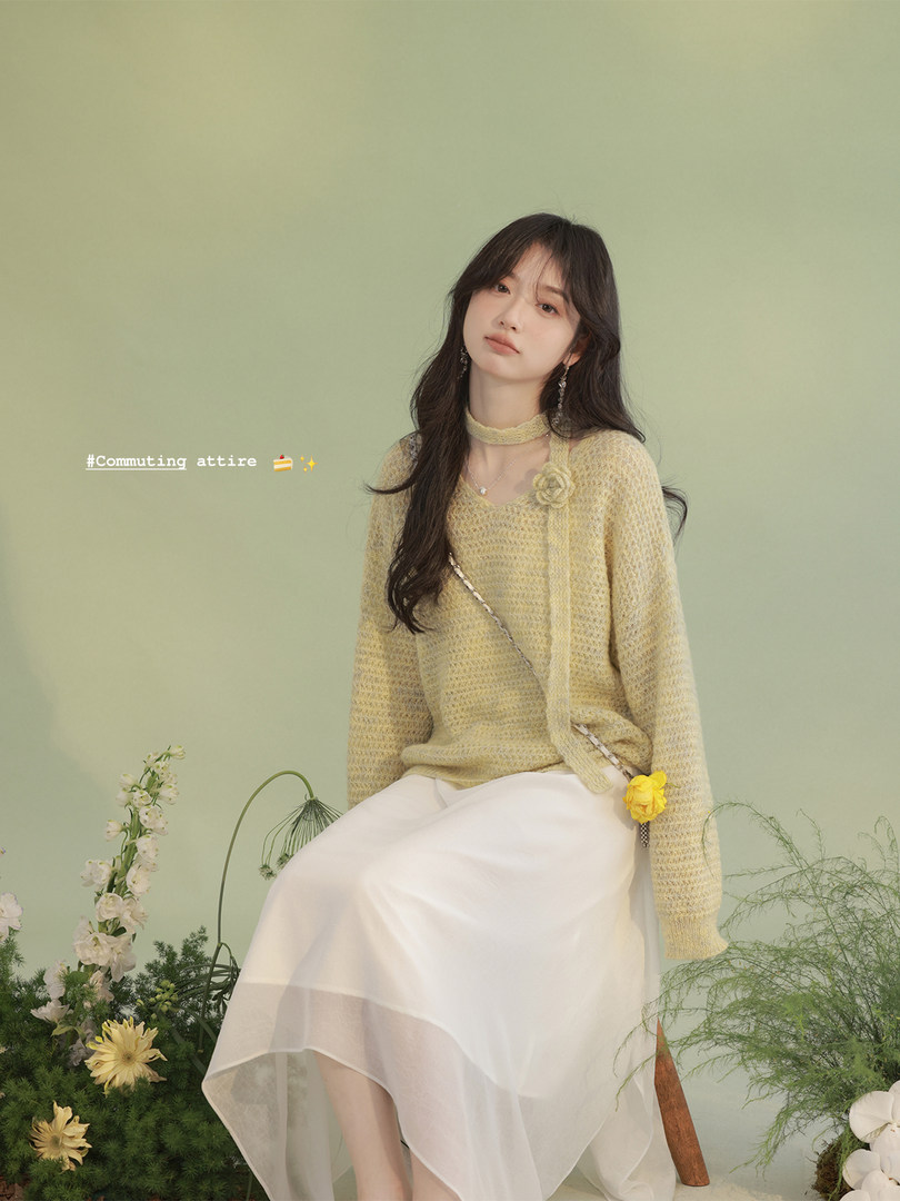 Model wearing a light yellow knit top with a white sheer skirt