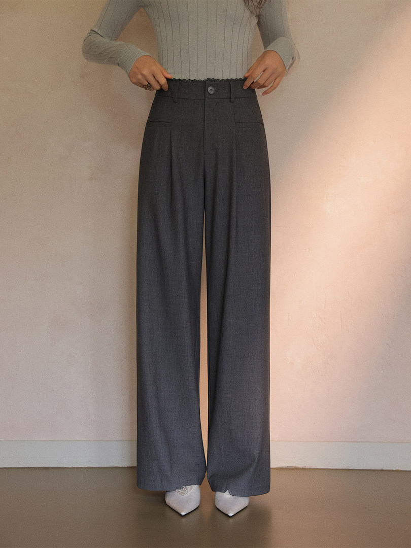 Gray high-waisted wide-leg trousers worn with a fitted top