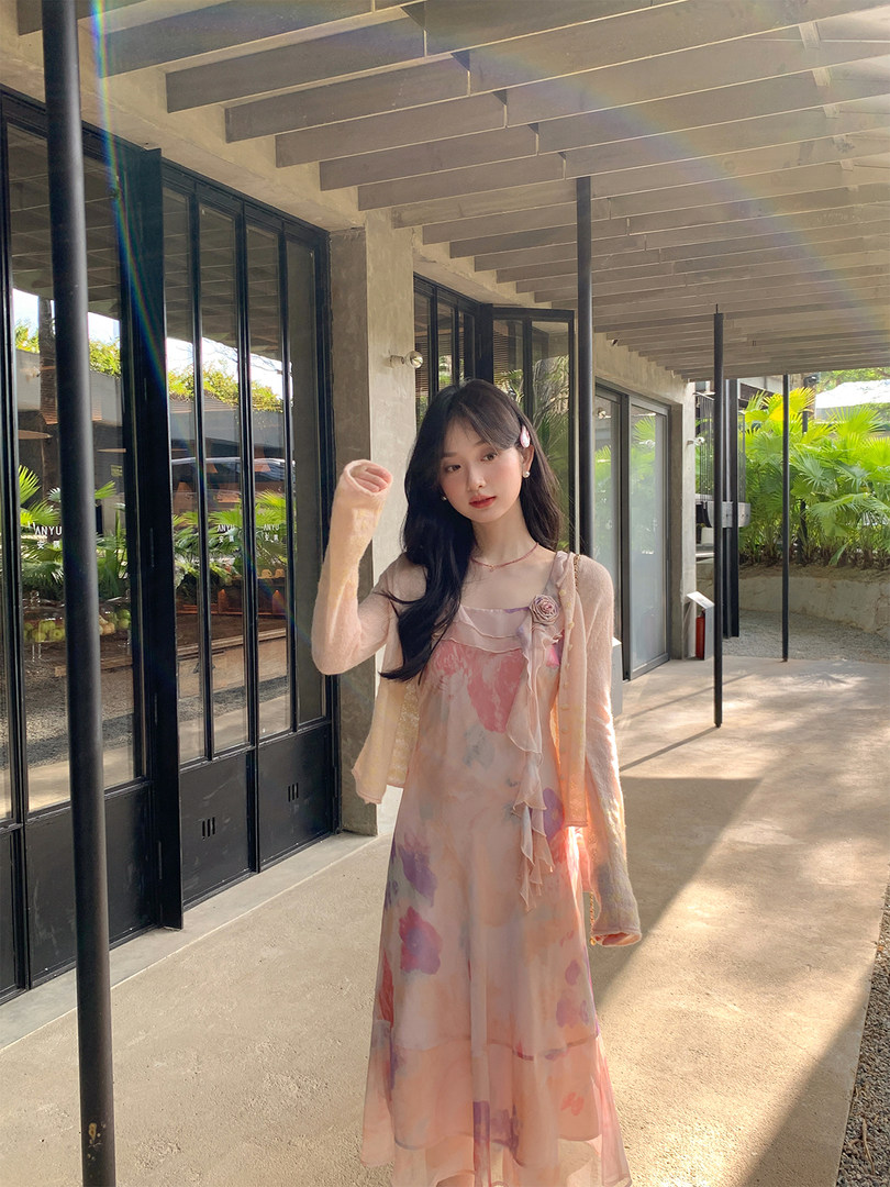Pastel floral sheer dress worn by a model outdoors