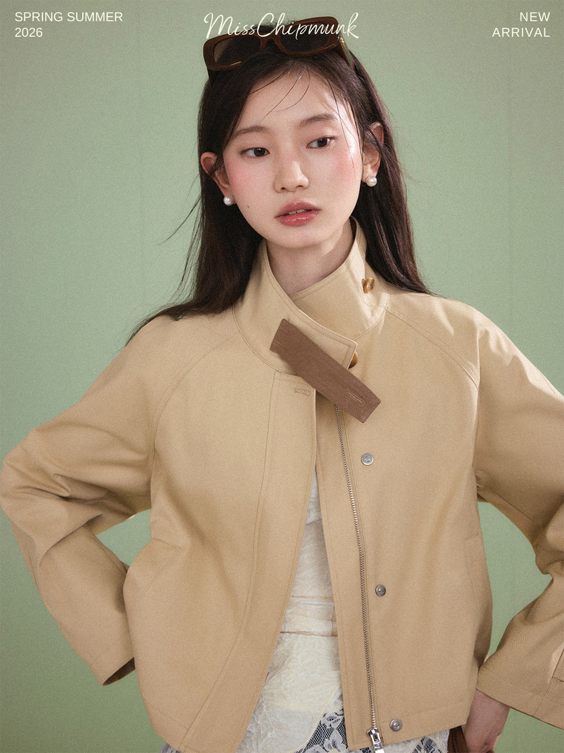 Beige jacket worn by a model with spring summer new arrival text overlay