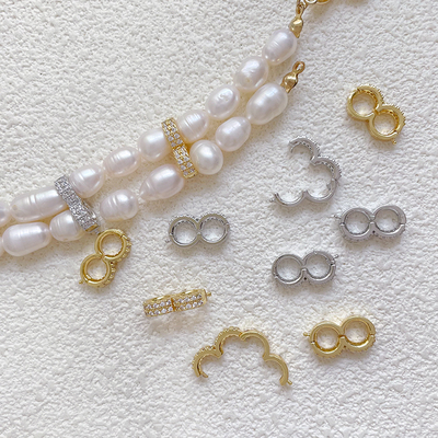 铜镀保色葫芦镶锆石扣