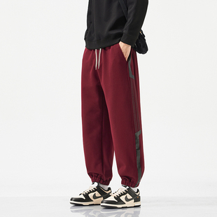 红色运动裤男款春秋2026新款抽绳高腰休闲卫裤宽松显瘦束脚哈伦裤