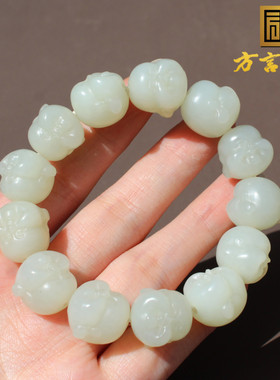 新疆且末料羊脂白玉精雕佛头手串