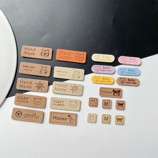 手工DIY毛线玩偶包包装饰皮标压花笑脸兔子图案皮革服装鞋包织唛