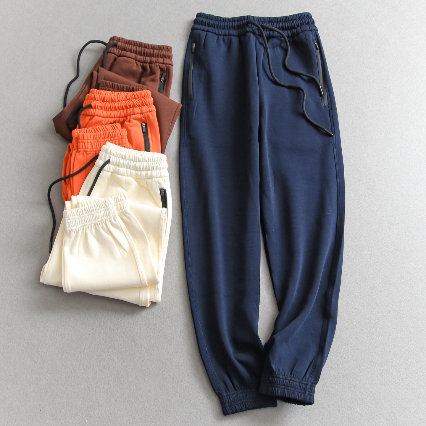 运动松紧腰纯色拉链口袋束脚卫裤