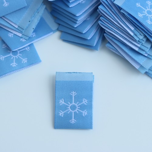 蓝色雪花双面对折布标现货