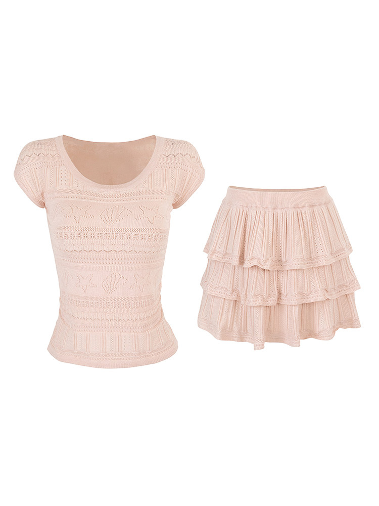 Pink knitted top and tiered skirt set on white background
