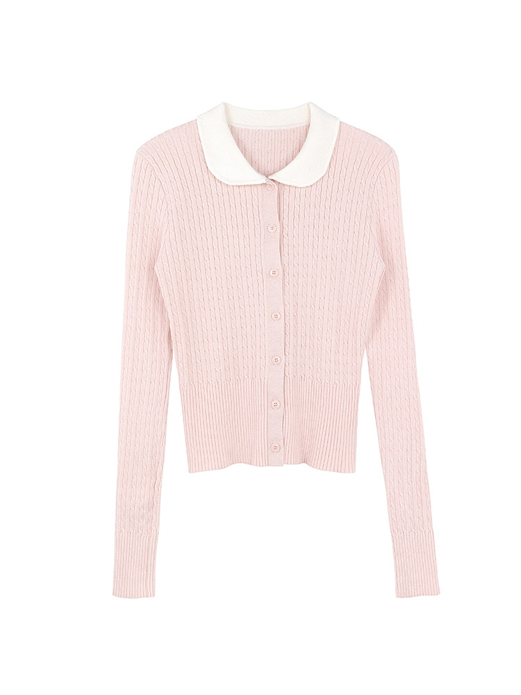 Pink ribbed knit cardigan with white collar displayed flat