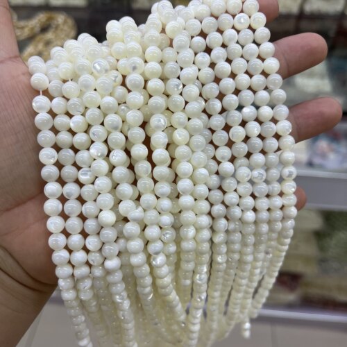 新品尝鲜6mm天然马蹄螺贝圆珠散珠闪光猫眼效应一条38厘米长