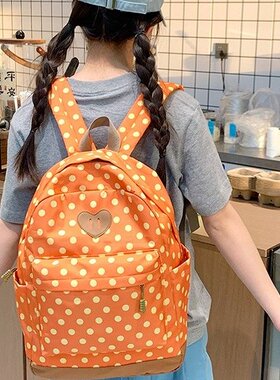 新款橙色波点女孩书包包初高中高颜值简约背包百搭休闲少女双肩包