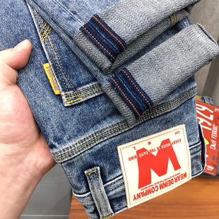 男士冬季九分牛仔裤2024高端潮流蓝色弹力修身小直筒长裤秋冬款