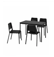 Черный обеденный стол с четырьмя стульями императора Одоса