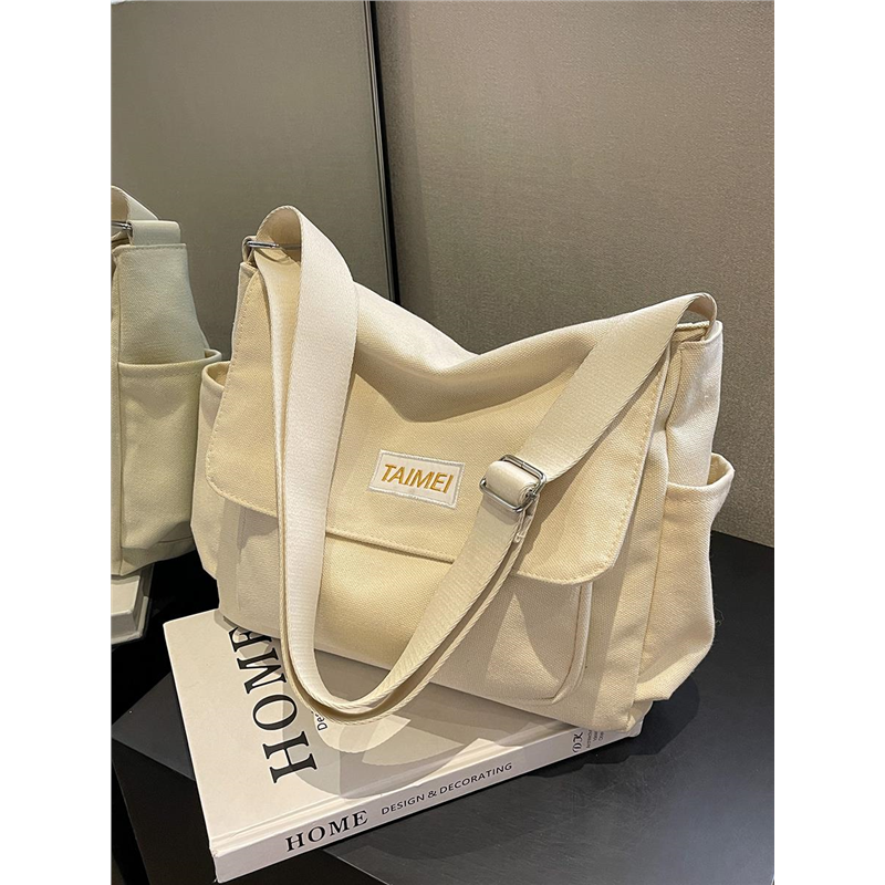 帆布包高级感小众包包女式2026新款超火上学大学生通勤单肩斜挎包