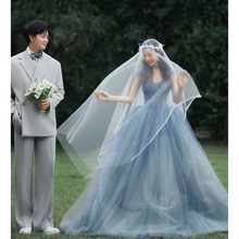 艺术照个人写真服装装彩纱2025新款森系情侣蓝色婚纱花童草坪礼服