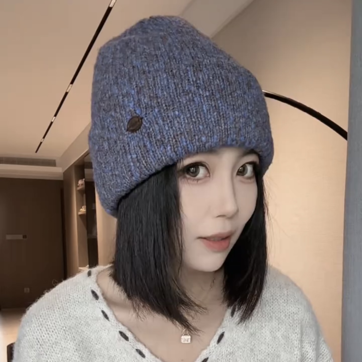 韩版针织毛线堆堆帽子女款2025秋冬新款保暖护耳紫色杂线月子冷帽