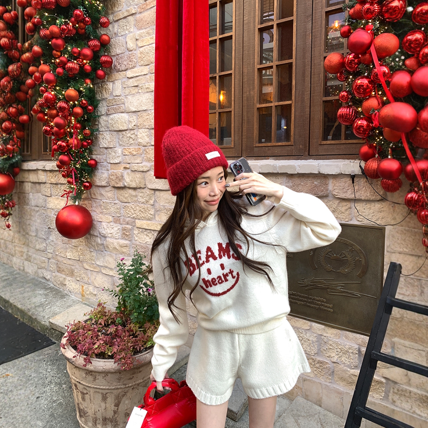 Haners家韩国代购女极简时尚2025年冬季新品微笑字母连帽针织衫