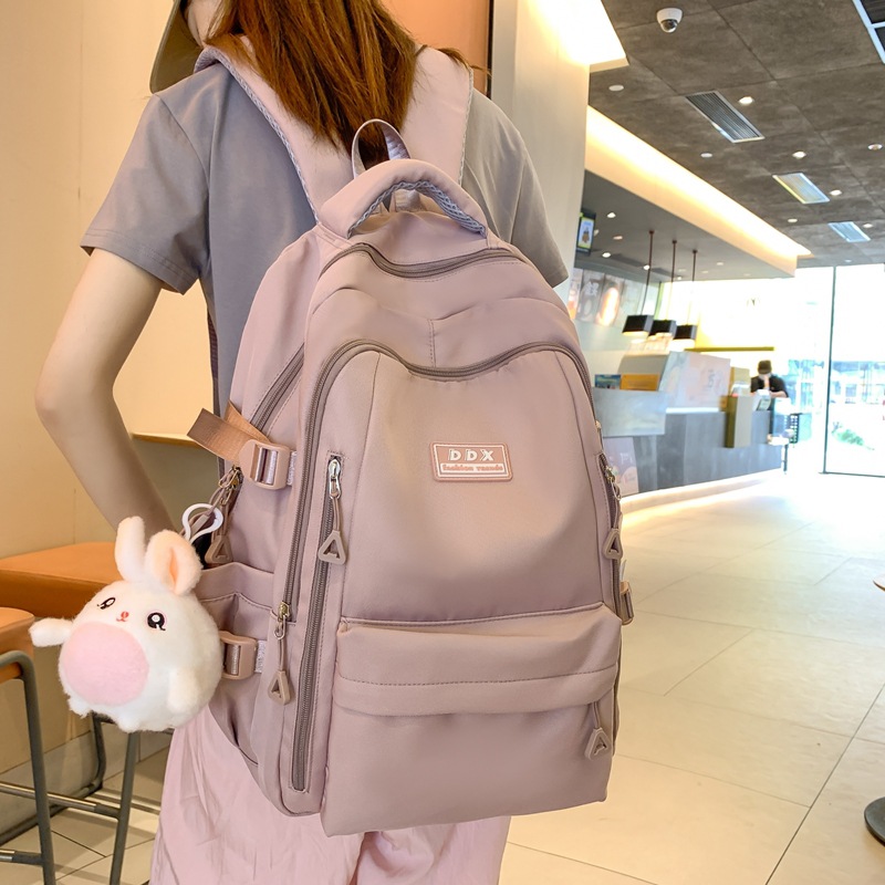 新款书包女大学生纯色大容量双肩包多层结实初高中学生双肩背包