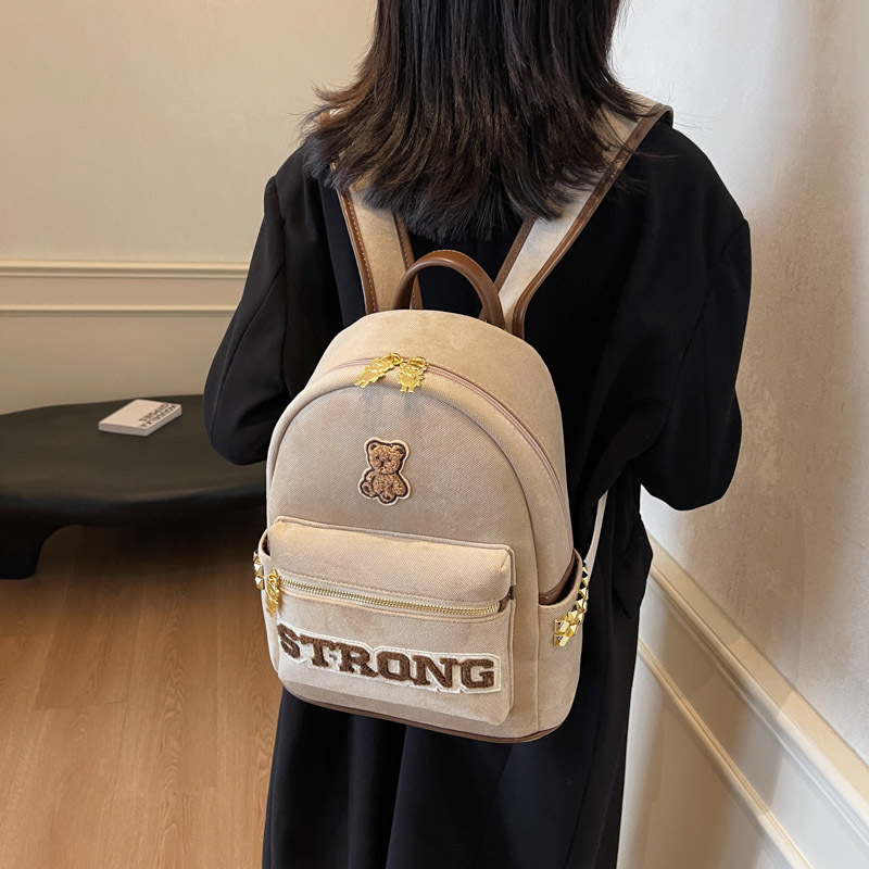 香港高级感轻便女式双肩包2025新款潮通勤帆布背包字母学生小书包