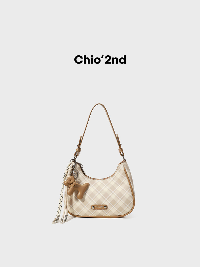 Beige plaid shoulder handbag with tassel charm on a white background