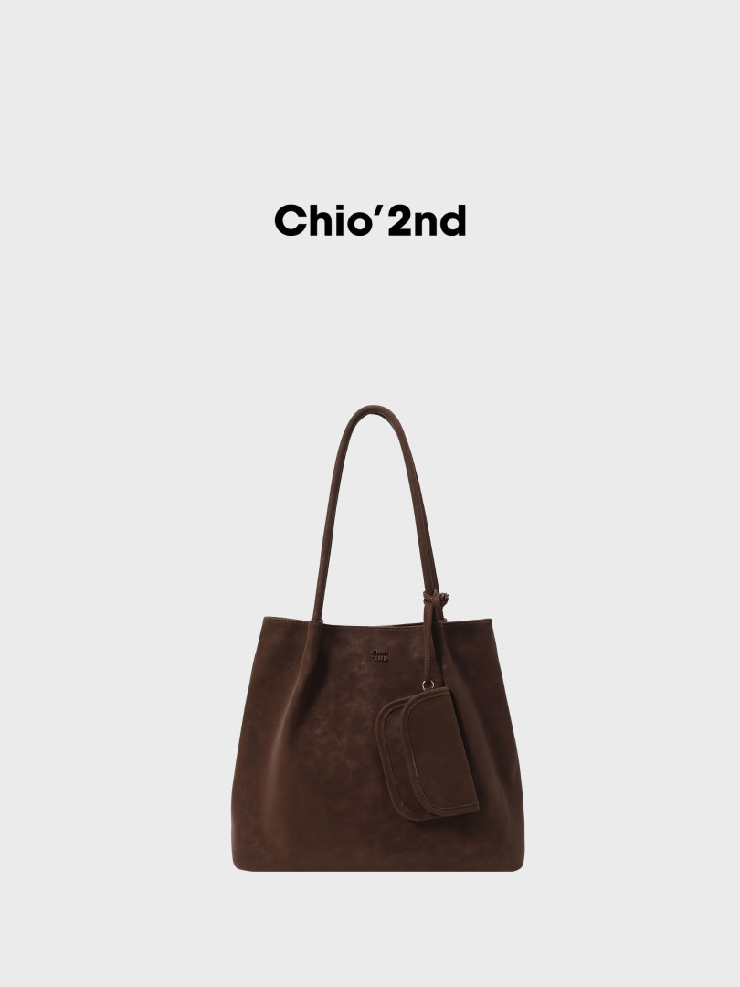Brown leather tote bag with long straps and a small front pouch