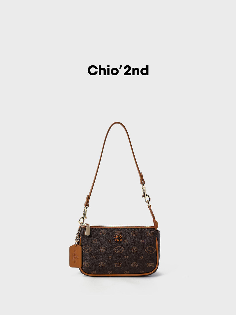 Brown monogram shoulder handbag with adjustable strap on a white background