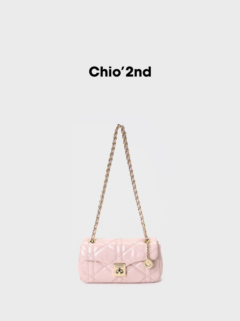 Pink quilted chain-strap handbag on a white background