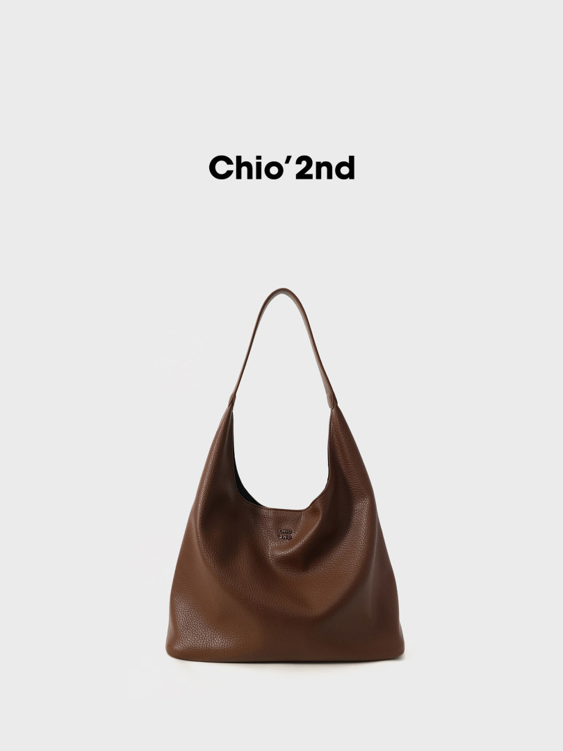 Brown leather shoulder bag on a white background