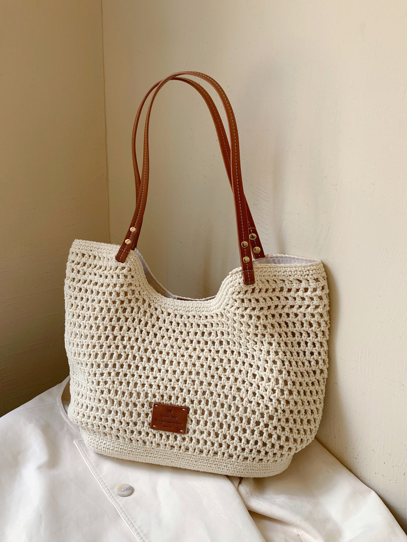 Cream crochet tote bag with brown leather handles