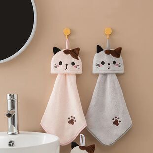 Cartoon kitten using a hand towel, a water-absorbing