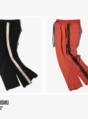 英籍设计师品牌UNDERLINE 侧面纽扣裤脚开合闪边高街宽松复古长裤