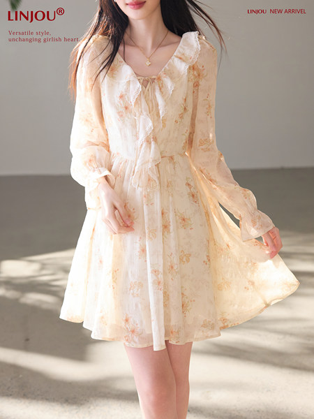 Model wearing a light floral long-sleeve dress