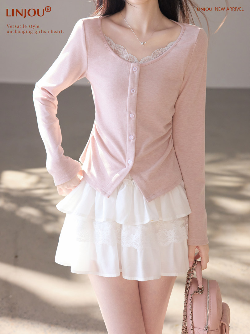 Model wearing a pink button-front cardigan with a white layered skirt