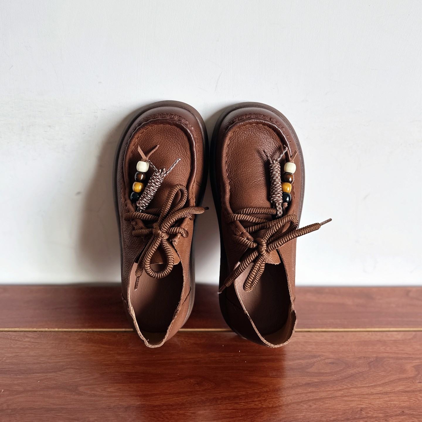 头层牛皮个性流苏系带休闲单鞋