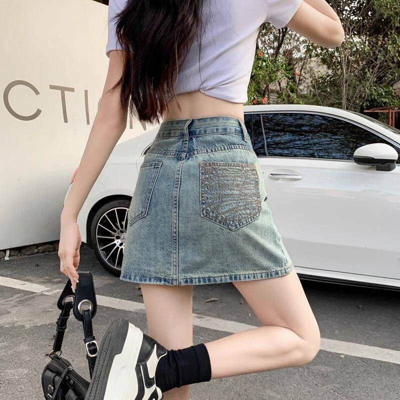 刺绣口袋牛仔半身裙2024年夏季新款高腰显瘦百搭小个子字包臀短裙