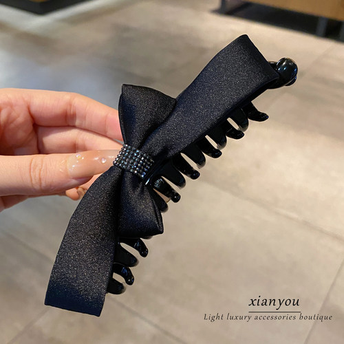 韩系蝴蝶结香蕉夹后脑勺扎马尾