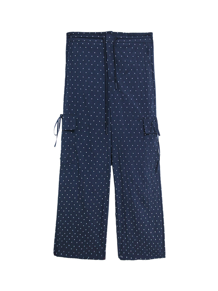 Navy blue polka dot cargo-style pants laid flat on a white background