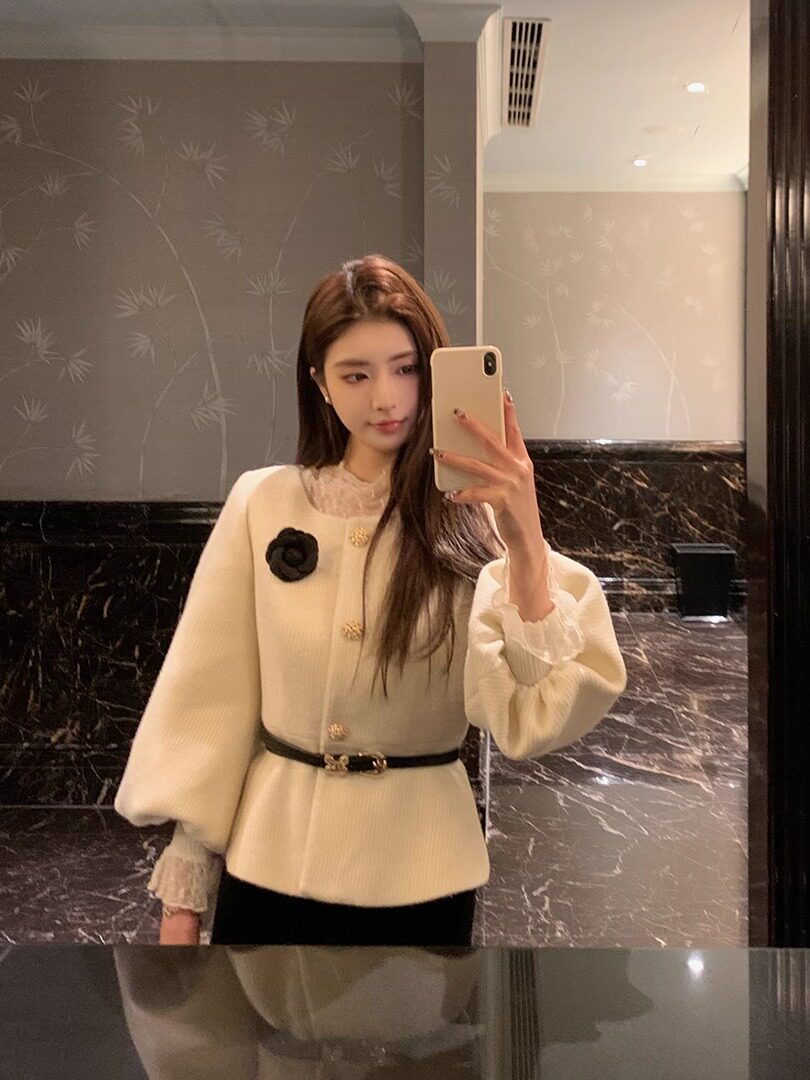 Cream belted long-sleeve top worn in a mirror selfie