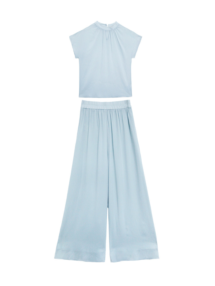 Light blue two-piece sleeveless top and wide-leg pants set laid flat on a white background