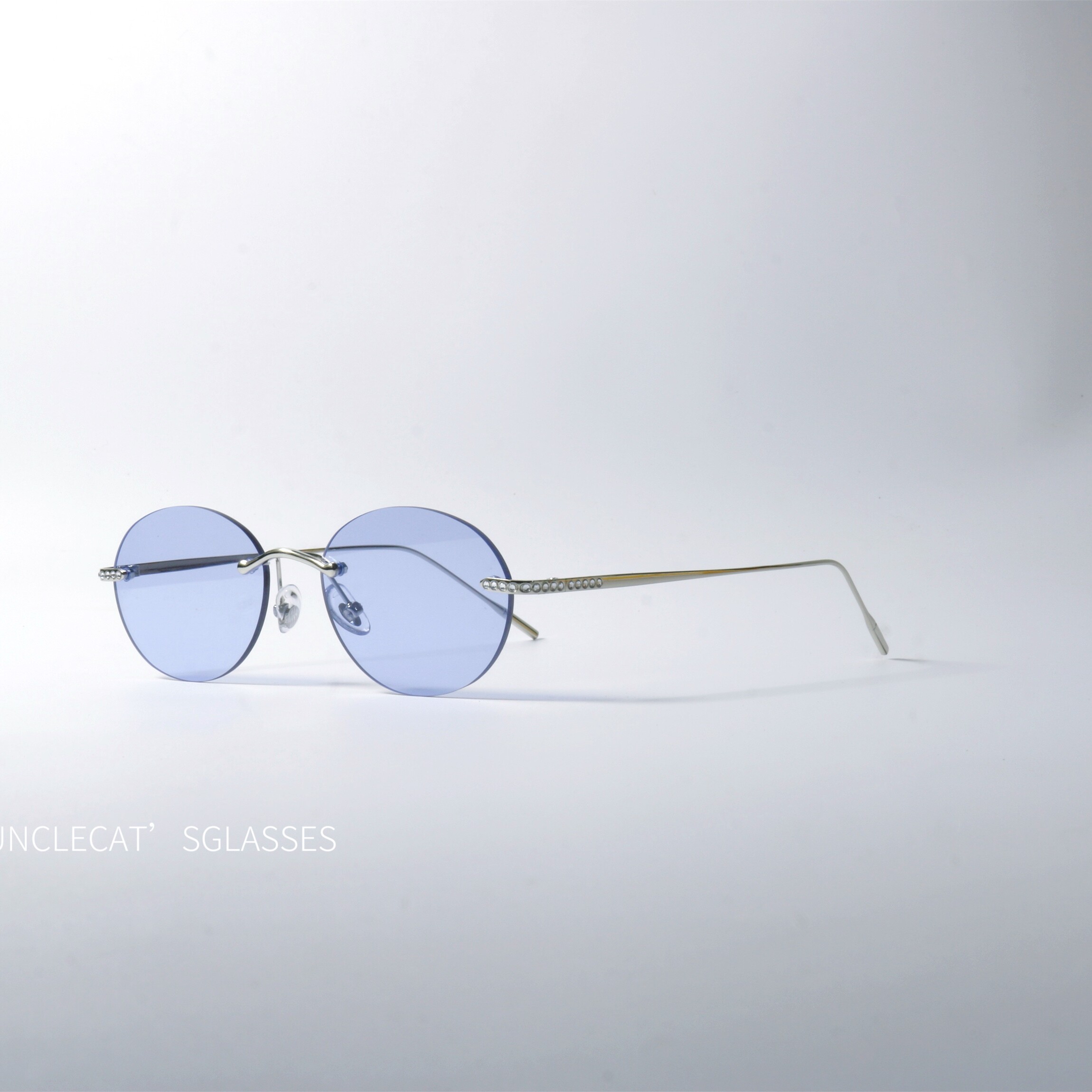 无框设计椭圆形碎钻太阳眼镜UV400防紫外线辐射防晒个性超轻墨镜