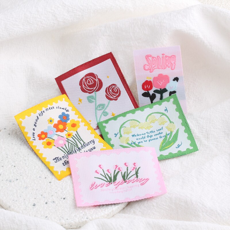 新款ins卡通花朵邮票织唛布贴布标背标手工DIY服饰装饰等配件辅料