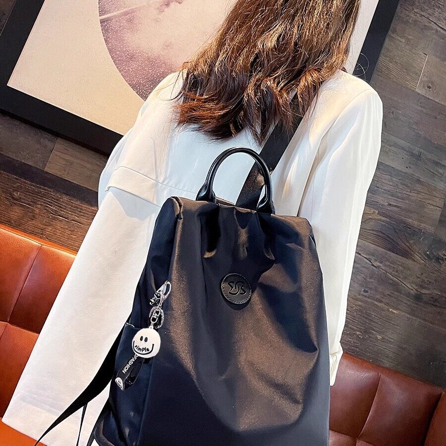 法国CavienKIon牛津布防盗双肩包2024新款潮纯色背包女士户外书包