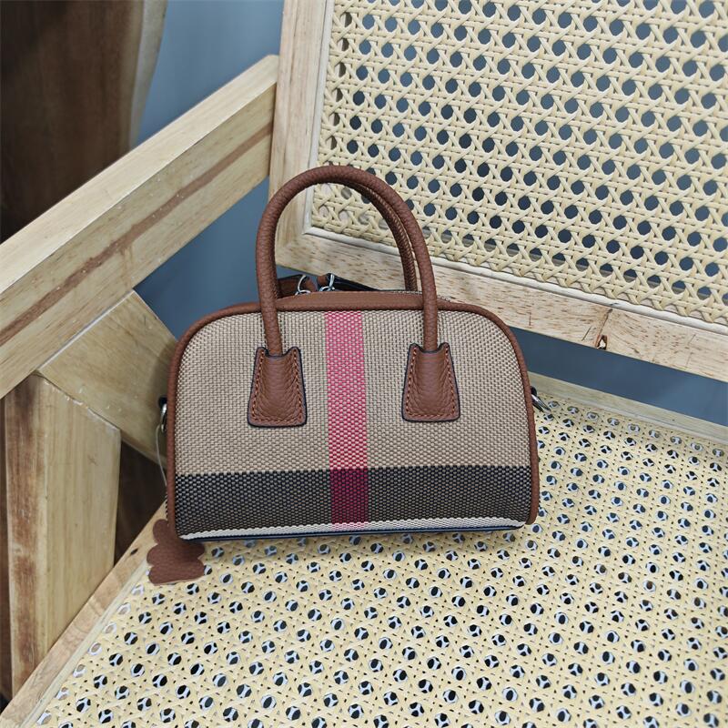 大甩卖头层牛皮配织物真皮女士包