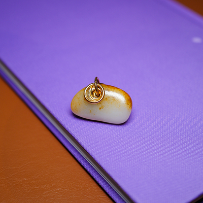 秋会长的和田玉籽料原石金镶玉