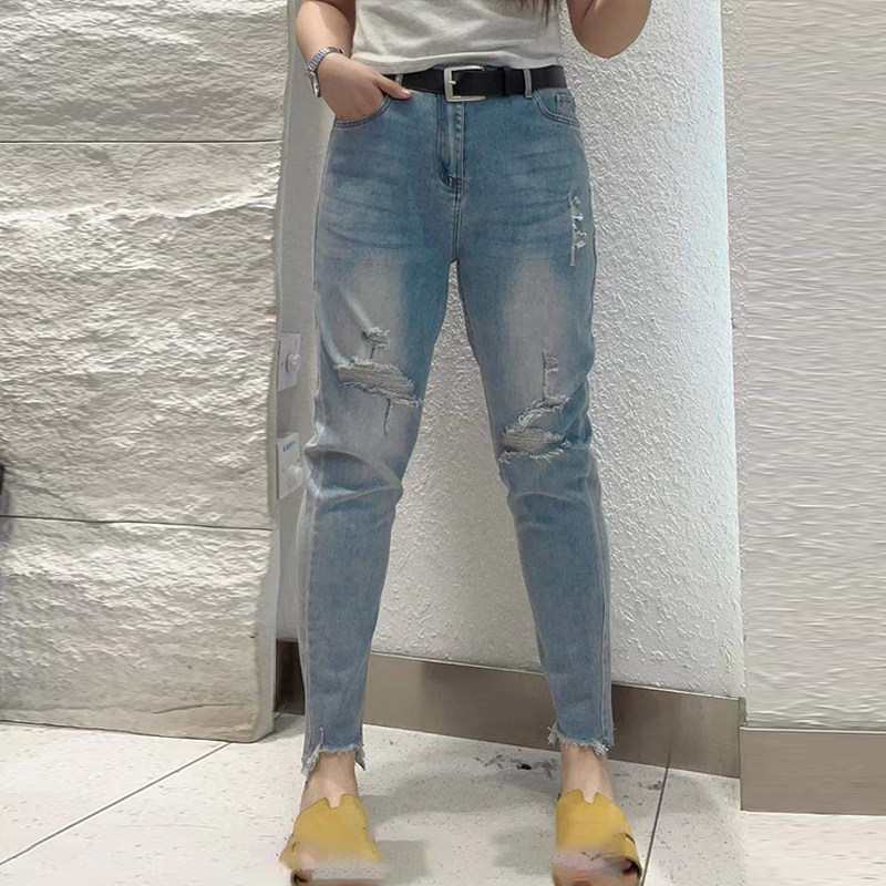 加肥女不规则裤脚破洞拉丝小脚牛仔裤胖妹妹欧货气质设计感九分裤