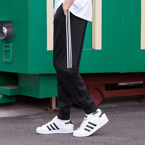阿迪达斯针织长裤男2026春季新款运动裤黑色小脚裤休闲裤子IA8182