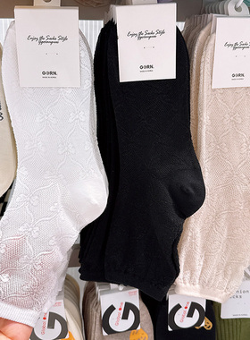 韩国东大门袜子女中筒袜2025春夏新款镂空网眼纯色蝴蝶结白色棉袜