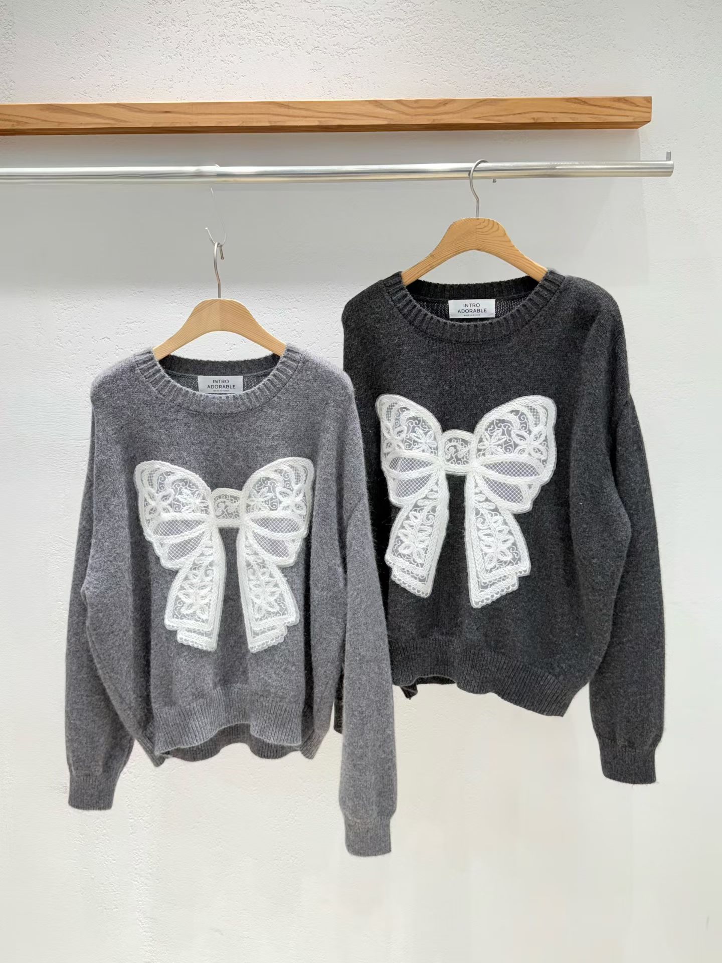 韩国东大门2025新款INTRO时尚百搭蝴蝶结毛衣女宽松针织衫