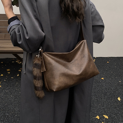 THE COLE秋冬高级小众托特包女斜挎包简约百搭大气饺子包通勤包